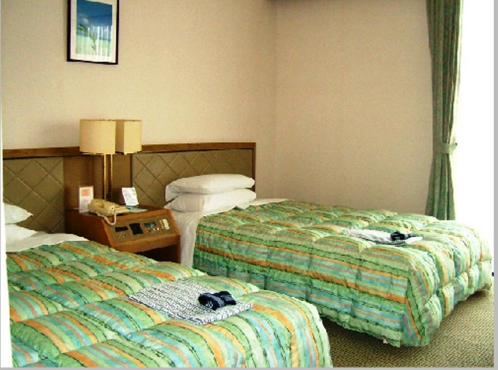 Hotel City Court Наха Номер фото